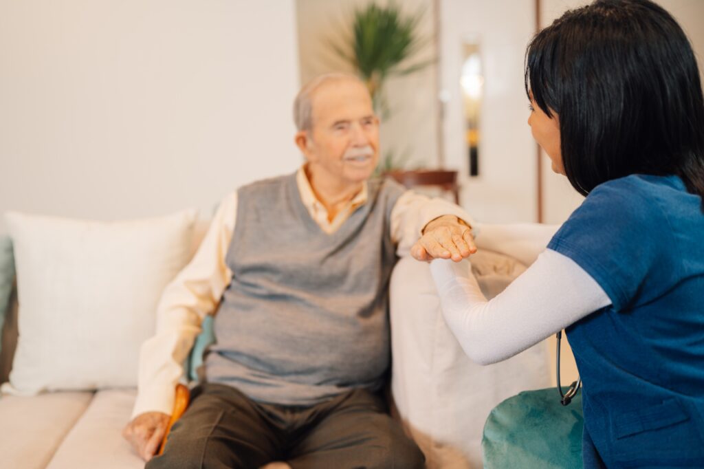 Home nurse giving advice to an old man